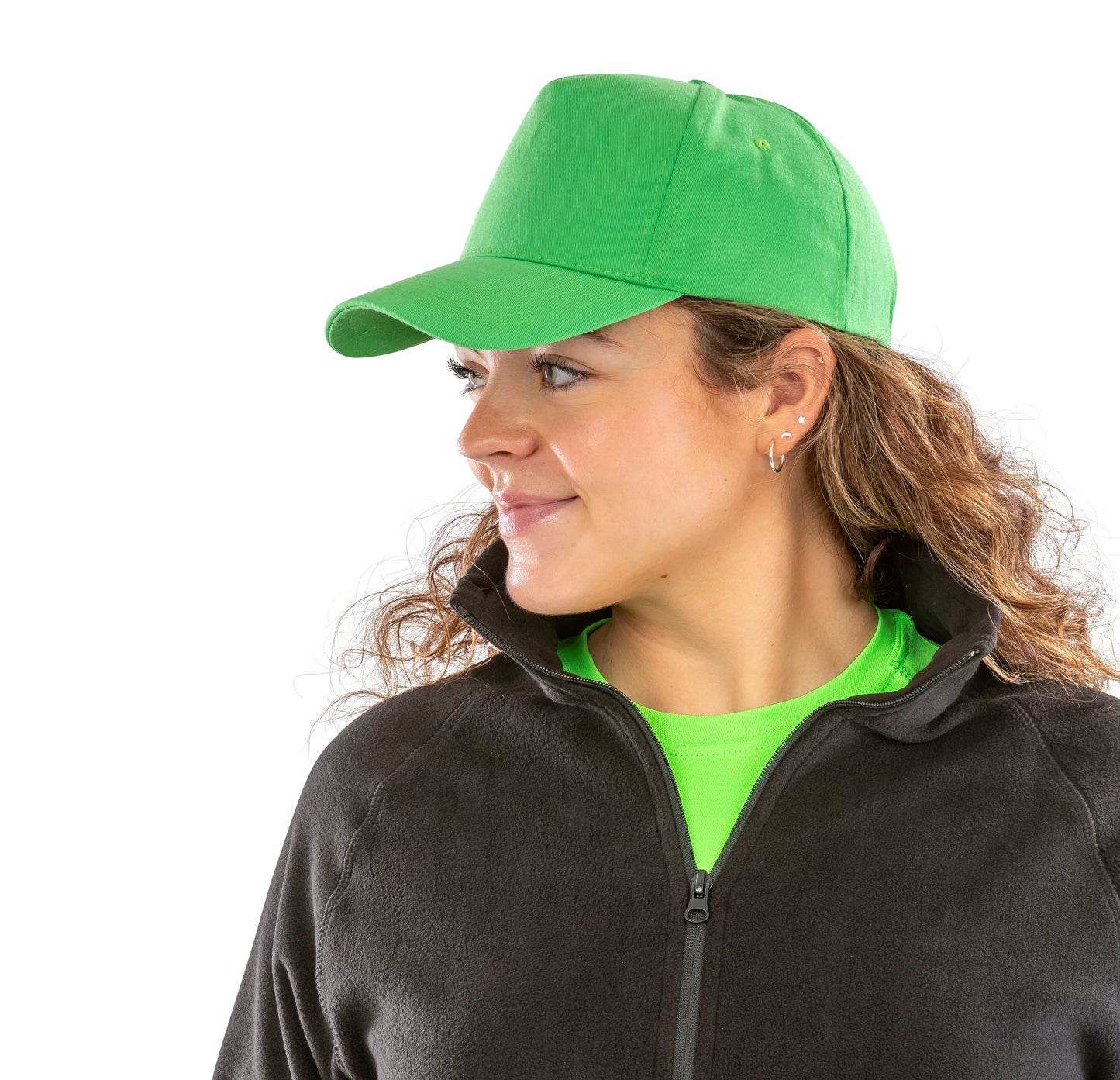 Woman wearing a green cap and black jacket with a white background